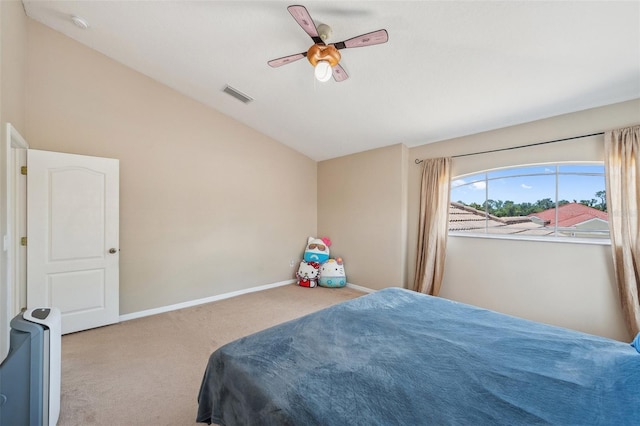 11726 Belle Haven Dr, New Port Richey, FL 34654 - carpeted bedroom with lofted ceiling, baseboards, and a ceiling fan