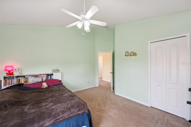 11726 Belle Haven Dr, New Port Richey, FL 34654 - carpeted bedroom with baseboards, a high ceiling, a ceiling fan, and a closet