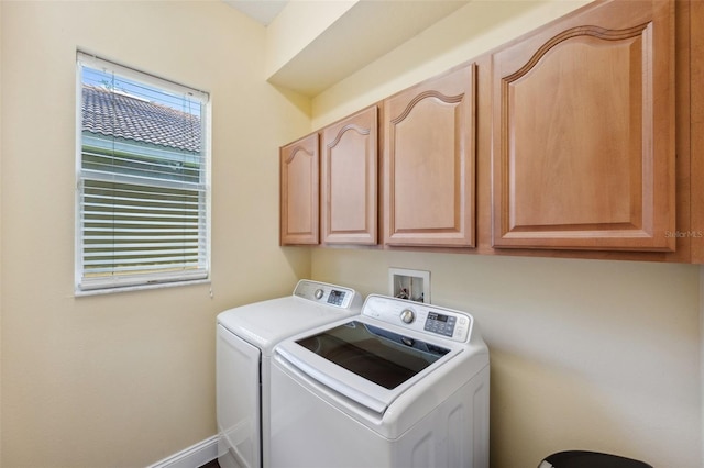 11726 Belle Haven Dr, New Port Richey, FL 34654 - washroom featuring washing machine and clothes dryer, cabinet space, and baseboards