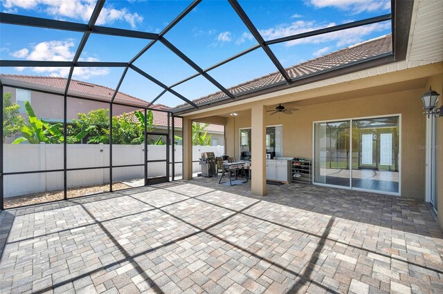 11726 Belle Haven Dr, New Port Richey, FL 34654 - view of patio featuring ceiling fan, outdoor dining space, and glass enclosure