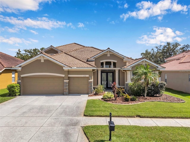 11726 Belle Haven Dr, New Port Richey, FL 34654 - mediterranean / spanish-style house with stucco siding, a garage, concrete driveway, a tile roof, and a front yard