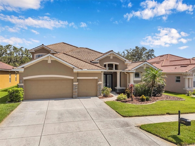 11726 Belle Haven Dr, New Port Richey, FL 34654 - mediterranean / spanish house with stucco siding, an attached garage, a tile roof, concrete driveway, and a front yard