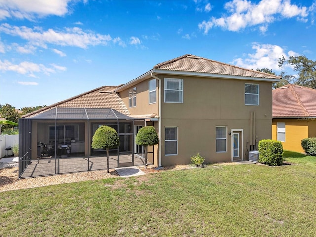 11726 Belle Haven Dr, New Port Richey, FL 34654 - back of property featuring a tile roof, a patio area, stucco siding, and central AC unit