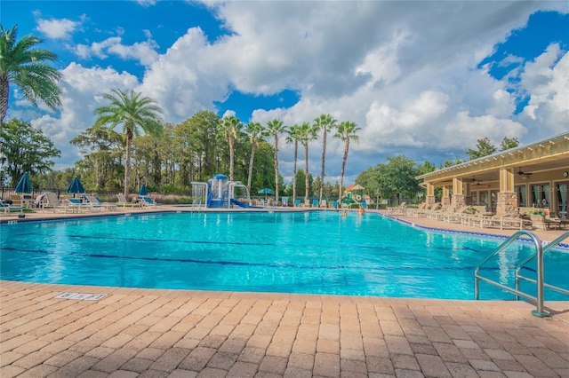 11726 Belle Haven Dr, New Port Richey, FL 34654 - community pool with a patio and a ceiling fan