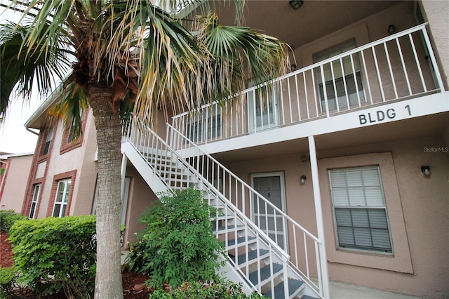 6338 Spring Flower Dr Unit 21, New Port Richey, FL 34653 - view of property with stairway