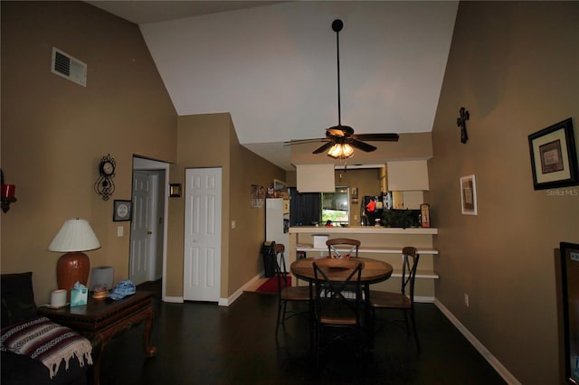 6338 Spring Flower Dr Unit 21, New Port Richey, FL 34653 - dining area with high vaulted ceiling, baseboards, a ceiling fan, and dark wood-style flooring