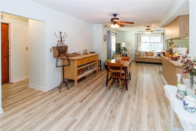 9630 Eldridge Rd, Spring Hill, FL 34608 - dining space with a ceiling fan, light wood finished floors, and baseboards