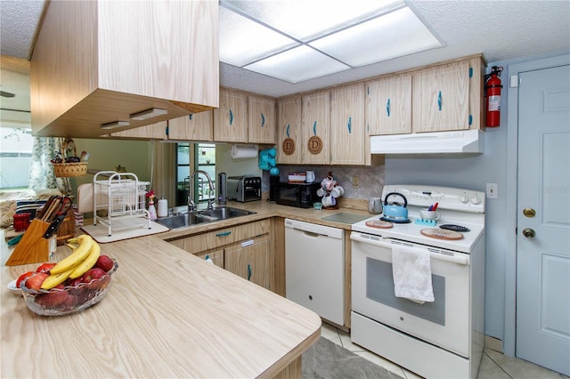 9630 Eldridge Rd, Spring Hill, FL 34608 - kitchen with white appliances, under cabinet range hood, a sink, a textured ceiling, and light countertops