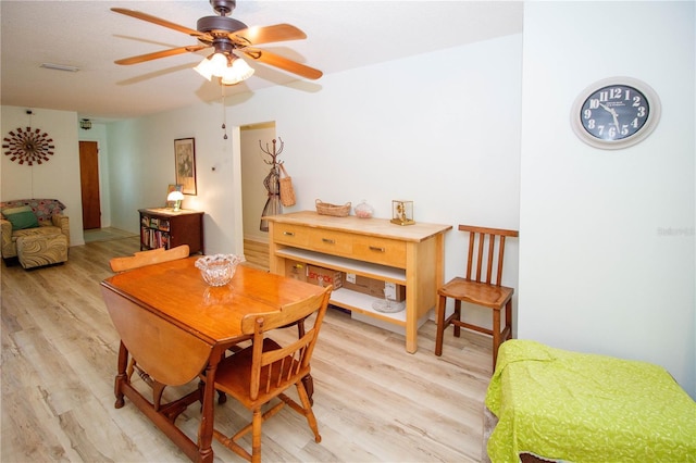 9630 Eldridge Rd, Spring Hill, FL 34608 - dining room featuring light wood finished floors and ceiling fan