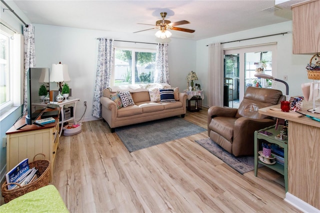 9630 Eldridge Rd, Spring Hill, FL 34608 - living area featuring light wood-style flooring and a ceiling fan