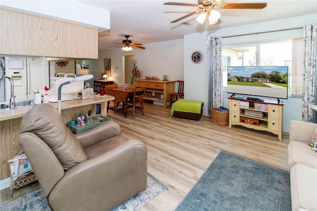 9630 Eldridge Rd, Spring Hill, FL 34608 - living room featuring a ceiling fan and light wood-type flooring