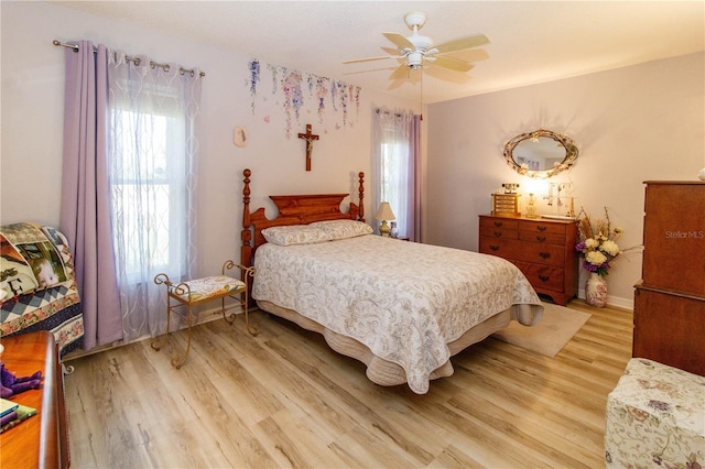 9630 Eldridge Rd, Spring Hill, FL 34608 - bedroom with light wood-style flooring and ceiling fan