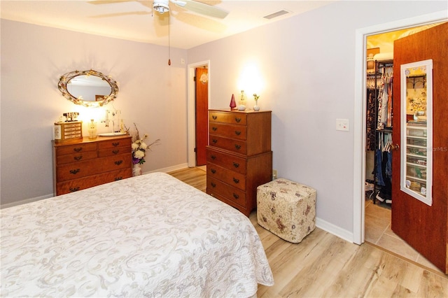 9630 Eldridge Rd, Spring Hill, FL 34608 - bedroom with light wood-type flooring, baseboards, and a ceiling fan