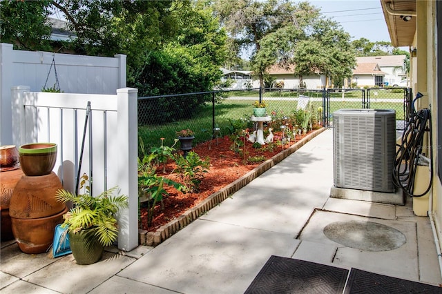 9630 Eldridge Rd, Spring Hill, FL 34608 - view of patio / terrace featuring central AC