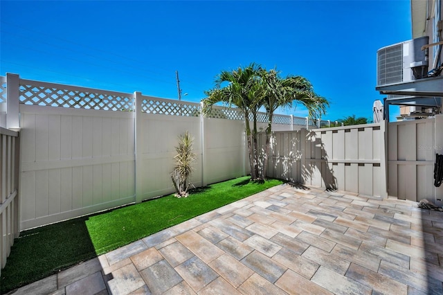 5032 Sand Castle Dr, New Port Richey, FL 34652 - fenced backyard with a patio