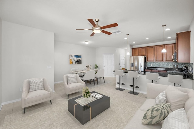 5032 Sand Castle Dr, New Port Richey, FL 34652 - living room with light tile patterned floors, a ceiling fan, and recessed lighting