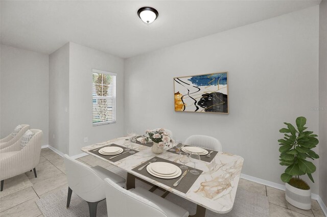 5032 Sand Castle Dr, New Port Richey, FL 34652 - dining room featuring light tile patterned flooring