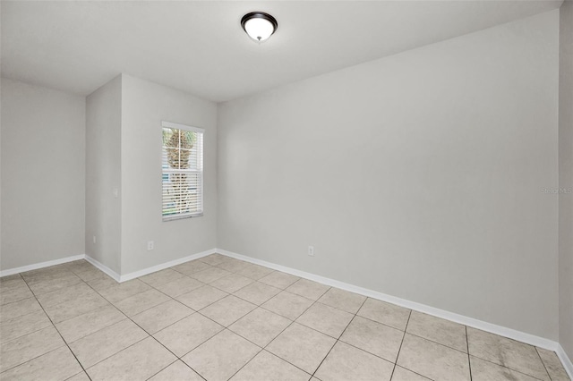 5032 Sand Castle Dr, New Port Richey, FL 34652 - unfurnished room featuring light tile patterned floors and baseboards