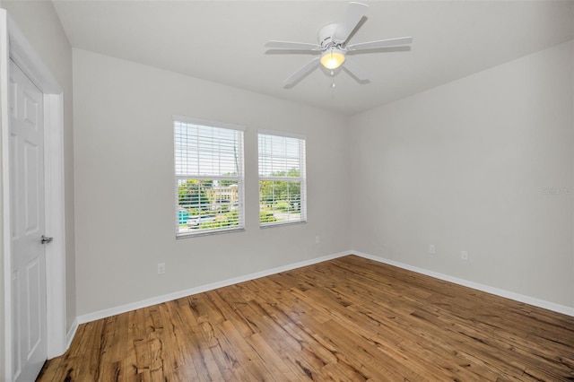 5032 Sand Castle Dr, New Port Richey, FL 34652 - unfurnished room with wood finished floors and ceiling fan