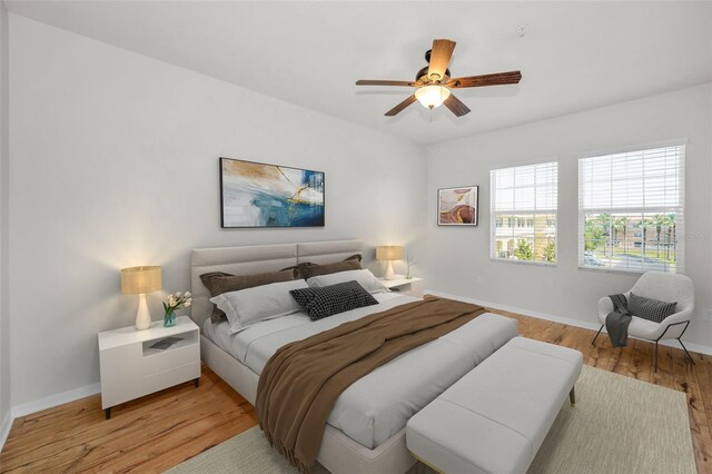5032 Sand Castle Dr, New Port Richey, FL 34652 - bedroom with light wood-type flooring and a ceiling fan