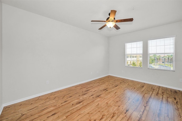 5032 Sand Castle Dr, New Port Richey, FL 34652 - empty room featuring wood-type flooring and a ceiling fan