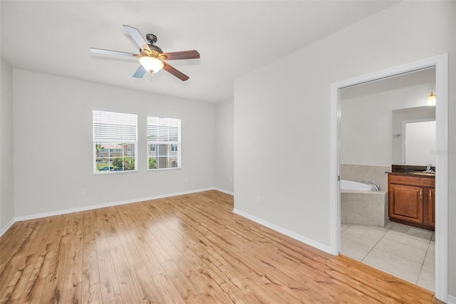 5032 Sand Castle Dr, New Port Richey, FL 34652 - spare room with ceiling fan and light wood-style flooring
