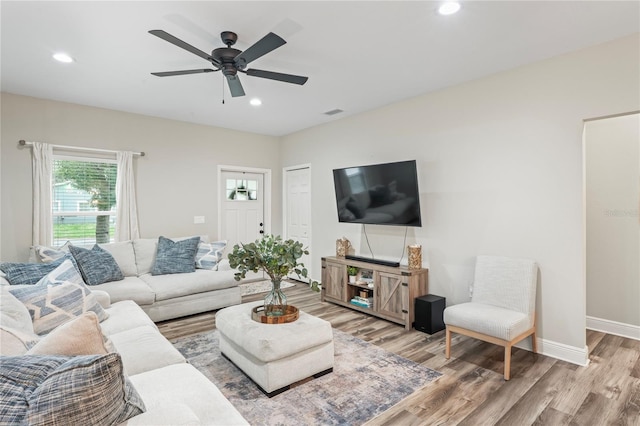 1601 E 98th Ave, Tampa, FL 33612 - living room featuring light wood-style flooring, ceiling fan, recessed lighting, and baseboards