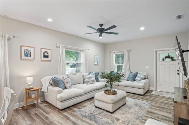 1601 E 98th Ave, Tampa, FL 33612 - living room featuring healthy amount of natural light, ceiling fan, wood finished floors, and recessed lighting