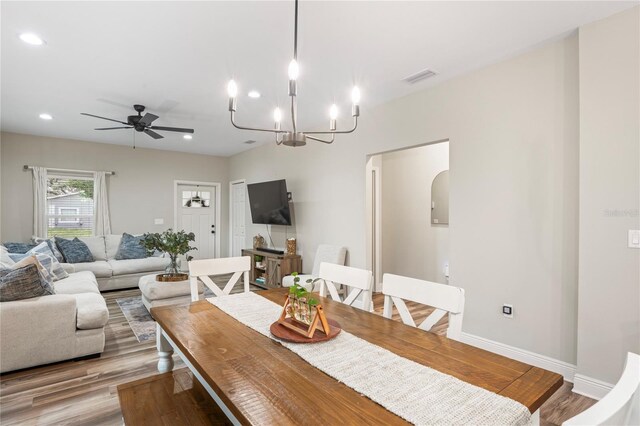 1601 E 98th Ave, Tampa, FL 33612 - dining space featuring light wood-type flooring, ceiling fan, recessed lighting, a chandelier, and baseboards