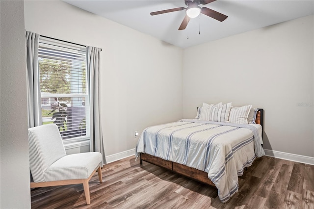 1601 E 98th Ave, Tampa, FL 33612 - bedroom with wood finished floors, baseboards, and ceiling fan