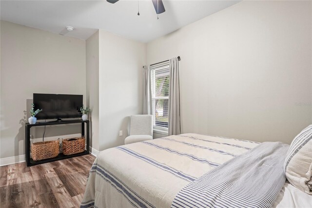 1601 E 98th Ave, Tampa, FL 33612 - bedroom with wood finished floors, baseboards, and a ceiling fan