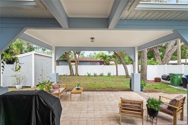 1601 E 98th Ave, Tampa, FL 33612 - fenced backyard with a patio and a grill