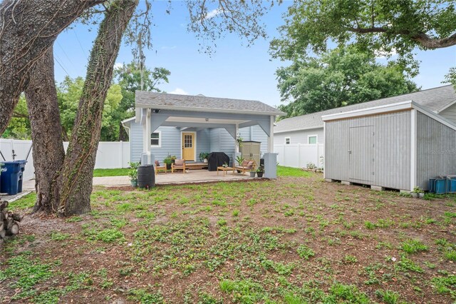 1601 E 98th Ave, Tampa, FL 33612 - rear view of property featuring a fenced backyard and a patio