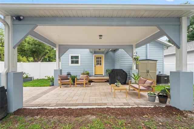 1601 E 98th Ave, Tampa, FL 33612 - view of patio featuring area for grilling and central air condition unit