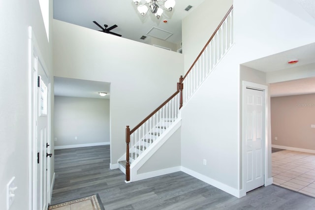 10386 Norvell Rd, Spring Hill, FL 34608 - staircase with wood finished floors and a towering ceiling