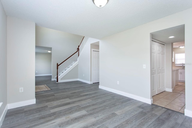 10386 Norvell Rd, Spring Hill, FL 34608 - unfurnished living room with wood finished floors and stairs