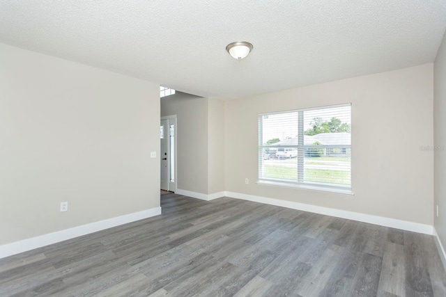 10386 Norvell Rd, Spring Hill, FL 34608 - unfurnished room with wood finished floors and a textured ceiling