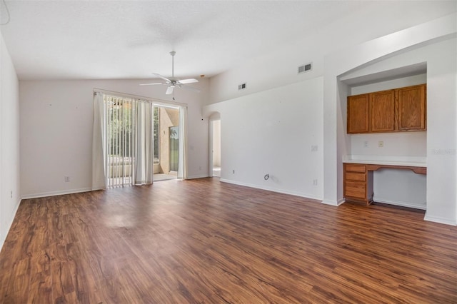 12027 Yellow Finch Ln, Trinity, FL 34655 - unfurnished living room with a ceiling fan, dark wood-type flooring, baseboards, and lofted ceiling