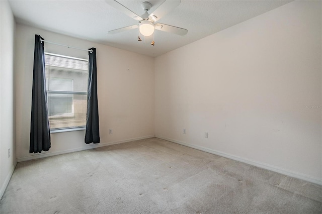 12027 Yellow Finch Ln, Trinity, FL 34655 - empty room featuring carpet, baseboards, and ceiling fan