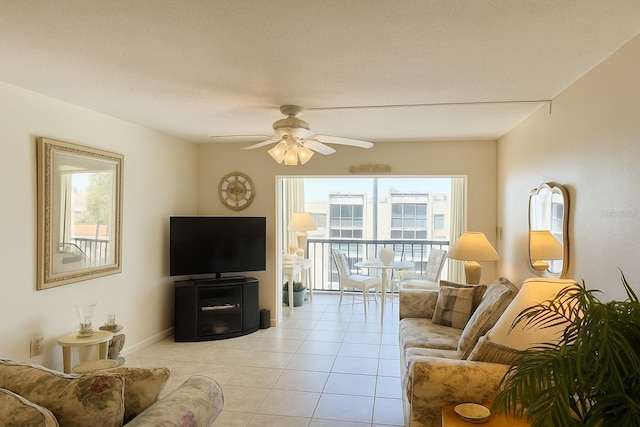 1243 S Martin Luther King Jr Ave Unit C505, Clearwater, FL 33756 - living room with plenty of natural light, light tile patterned flooring, a ceiling fan, and baseboards