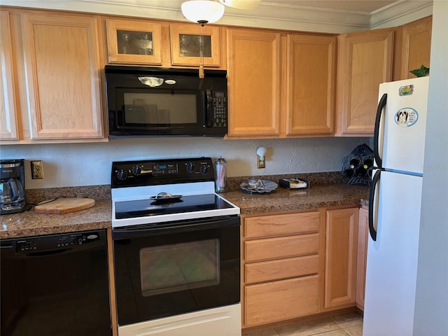 1243 S Martin Luther King Jr Ave Unit C505, Clearwater, FL 33756 - kitchen featuring black appliances, glass insert cabinets, and light brown cabinets