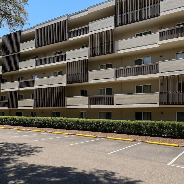 1243 S Martin Luther King Jr Ave Unit C505, Clearwater, FL 33756 - view of apartment building / complex with uncovered parking