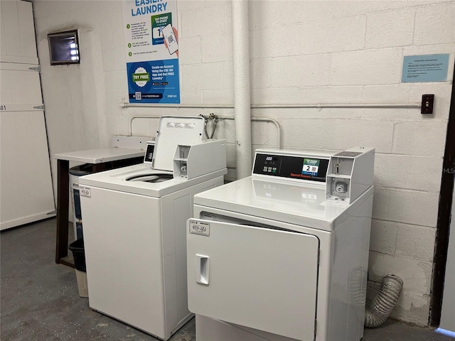1243 S Martin Luther King Jr Ave Unit C505, Clearwater, FL 33756 - community laundry room with independent washer and dryer and concrete block wall
