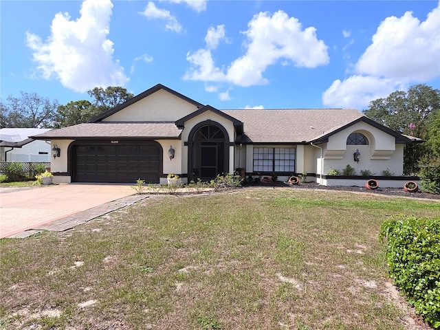 10244 Hoover St, Spring Hill, FL 34608 - single story home featuring stucco siding, a garage, a front yard, and driveway