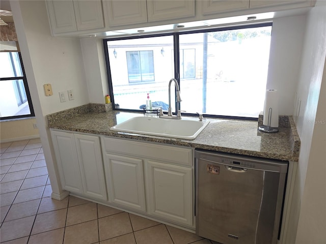 10244 Hoover St, Spring Hill, FL 34608 - kitchen featuring stainless steel dishwasher, white cabinetry, and light tile patterned floors
