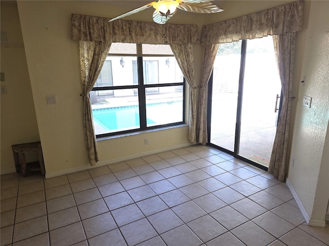 10244 Hoover St, Spring Hill, FL 34608 - unfurnished room with a ceiling fan and light tile patterned flooring