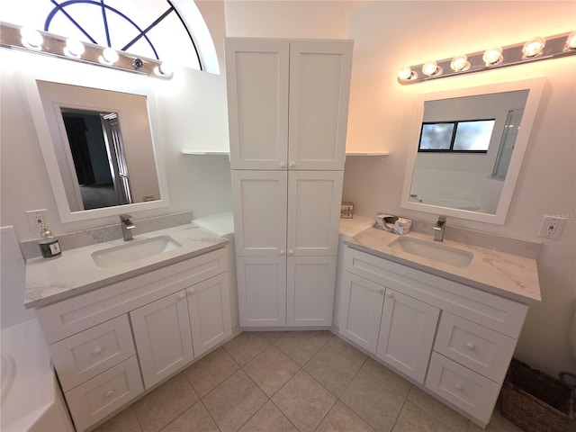 10244 Hoover St, Spring Hill, FL 34608 - full bath featuring two vanities and tile patterned flooring