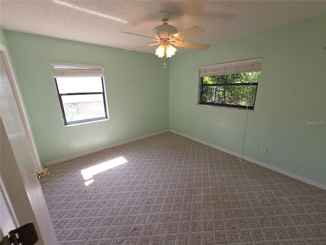 10244 Hoover St, Spring Hill, FL 34608 - empty room with carpet, a textured ceiling, and a ceiling fan