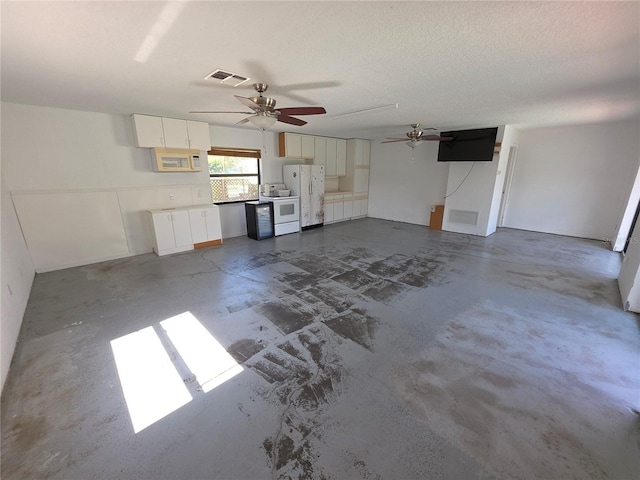 10244 Hoover St, Spring Hill, FL 34608 - unfurnished living room featuring a ceiling fan and unfinished concrete flooring