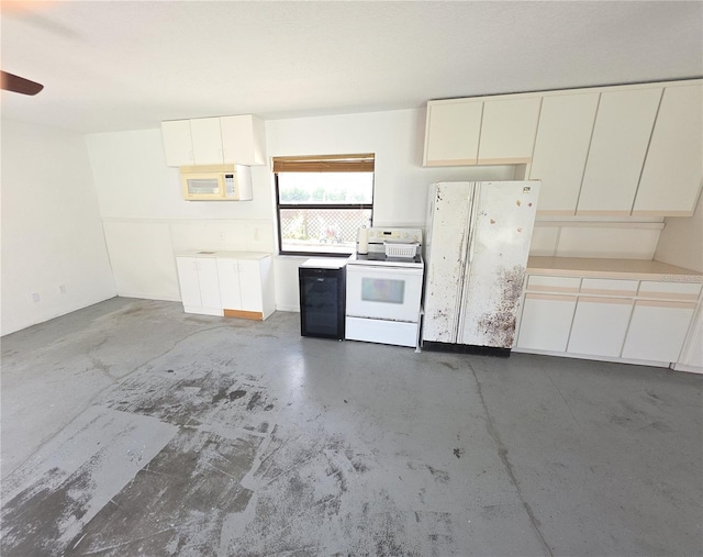 10244 Hoover St, Spring Hill, FL 34608 - kitchen with white appliances, concrete floors, light countertops, and white cabinetry
